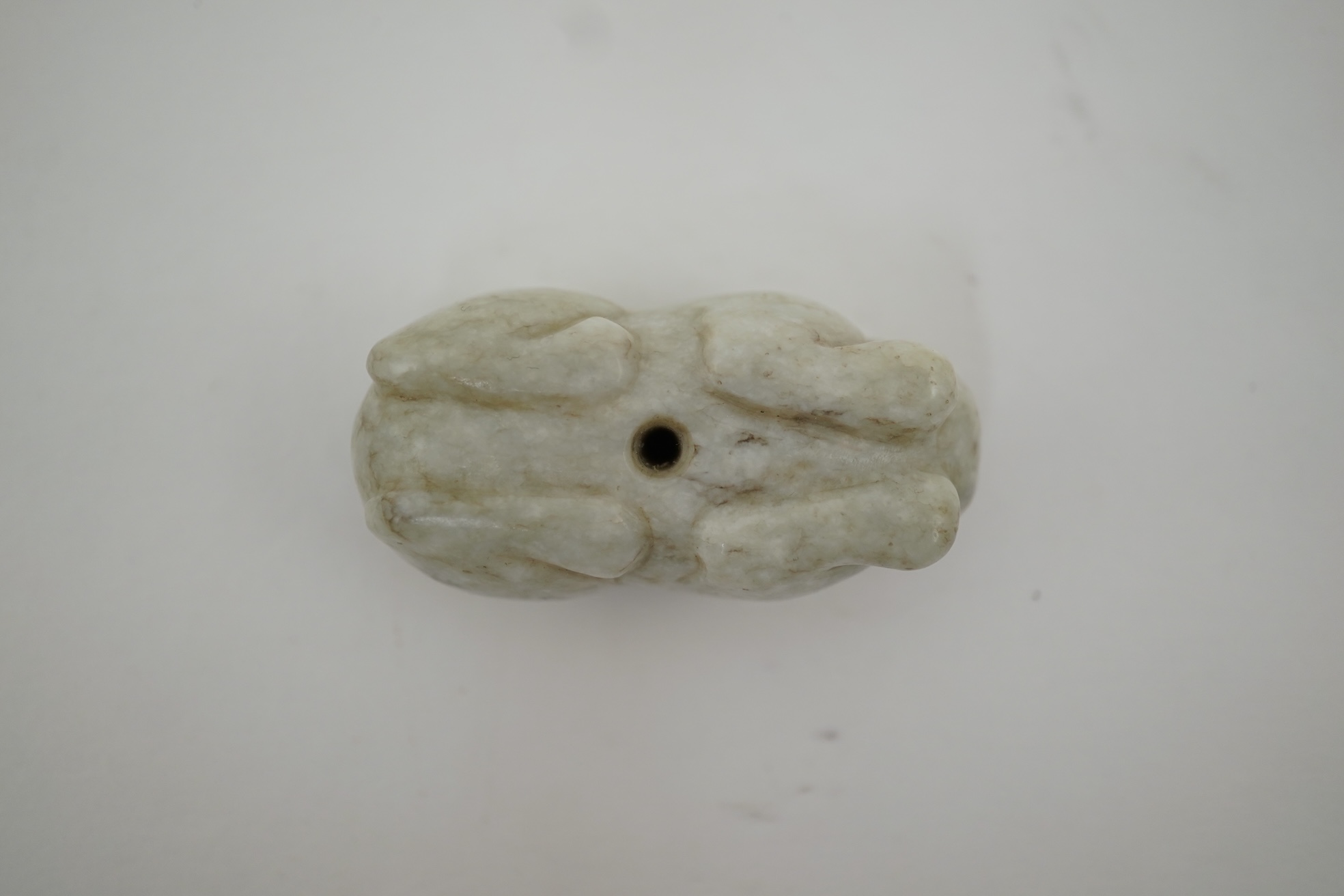 A Chinese white and black jade figure of a recumbent tiger, Song dynasty